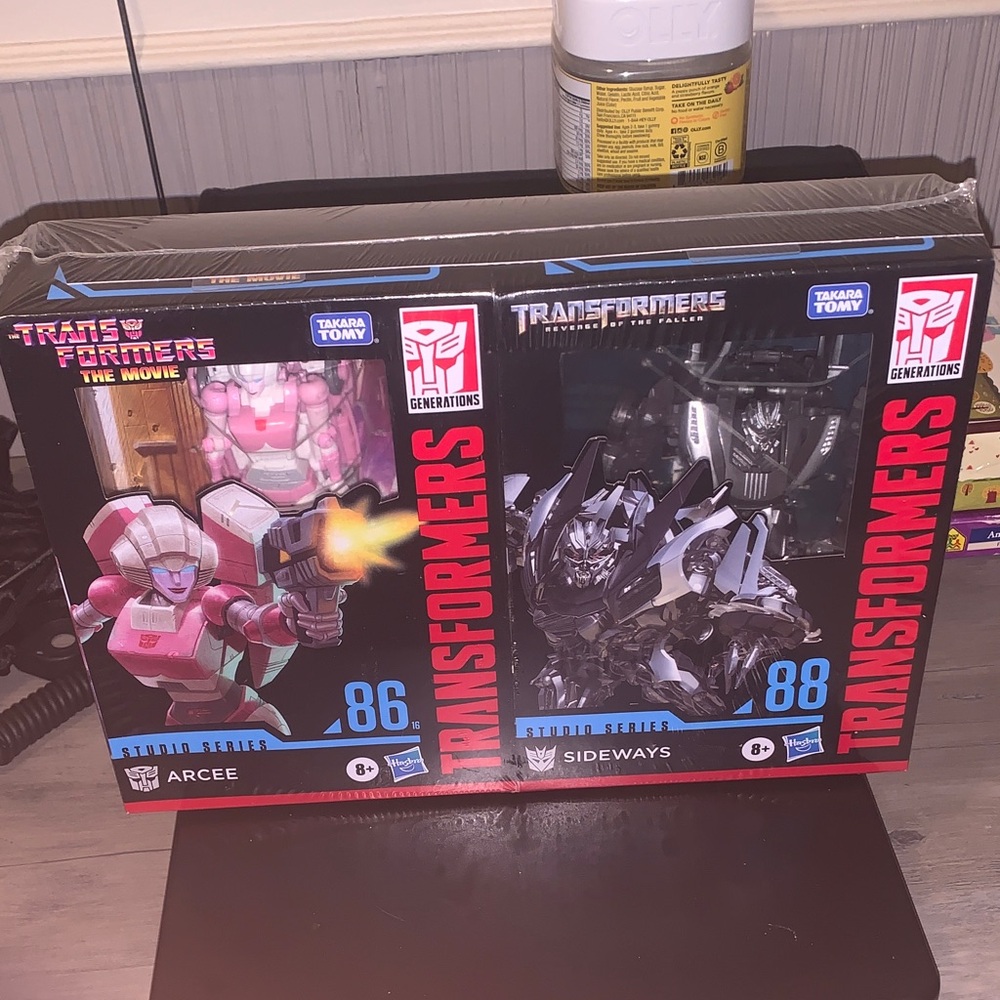Hasbro Transformers Arcee and Sideways Action Figures - Pink, Black, Red